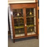 Art Nouveau stained leaded glass fronted display cabinet. (1 panel cracked) 87cm x depth 34cm x heig