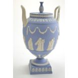 Wedgwood blue jasperware urn & cover, 20th century, decorated with classical muses, swags & other mo