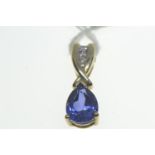 9ct gold pendant set with a blue teardrop stone & three diamonds, length 20mm, gross weight 1.6 gram