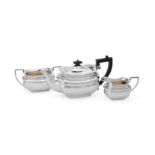 A SILVER OBLONG BALUSTER THREE PIECE TEA SERVICE, WILLIAM ADAMS LTD