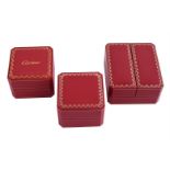 CARTIER THREE RED WATCH BOXES WITH GILT TOOLING