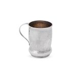 AN ARTS AND CRAFTS HAMMERED SILVER MUG, LIBERTY & CO.