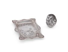 A SILVER NOVELTY PIN CUSHION AND A PUNCH MAGAZINE PIN TRAY, THE CUSHION NAMED HUMPTY DUMPTY