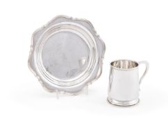 A SILVER SHAPED CIRCULAR DISH AND A MUG IN GEORGE II STYLE