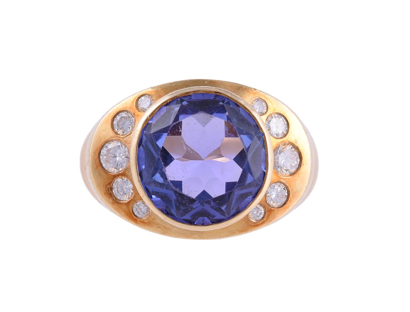 AN 18 CARAT GOLD TANZANITE AND DIAMOND DRESS RING, LONDON 1995