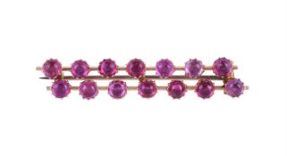 A LATE 19TH CENTURY CABOCHON RUBY BAR BROOCH, CIRCA 1890