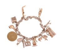 A GOLD COLOURED CHARM BRACELET