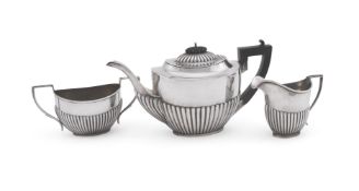A MATCHED SILVER OVAL THREE PIECE TEA SERVICE, WILLIAMS (BIRMINGHAM) LTD AND H. V. PITHEY & CO.
