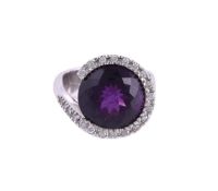 A DIAMOND AND AMETHYST DRESS RING