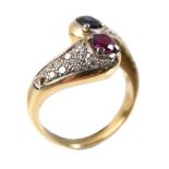A RUBY, SAPPHIRE AND DIAMOND CROSSOVER RING