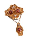 A VICTORIAN HESSONITE GARNET AND HALF PEARL BROOCH/PENDANT, CIRCA 1880