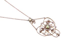 AN EDWARDIAN PERIDOT AND SEED PEARL PENDANT