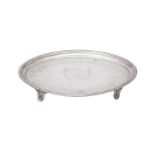 A GEORGE III SILVER SHAPED OVAL TEA POT STAND, CHARLES ALDRIDGE