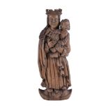 A Continental well carved oak group of Madonna and child
