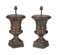 A pair of French bronze patinated cast iron urns