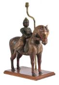 An Asian polychrome painted wood figure on horse back