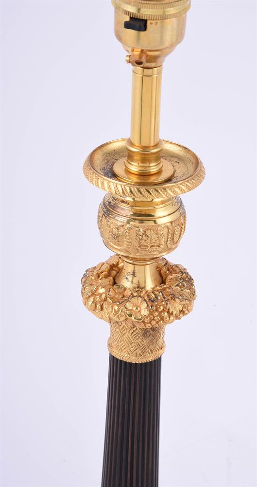 A pair of gilt and patinated metal candlesticks - Image 3 of 3