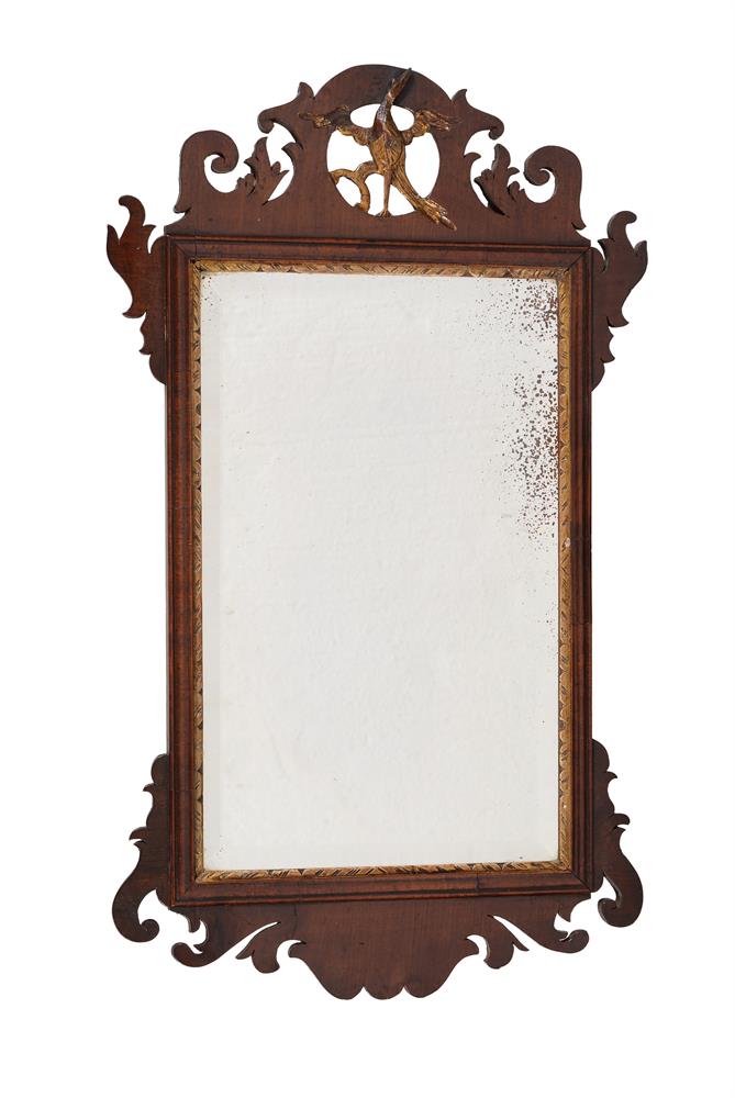 A George II mahogany and parcel gilt wall mirror