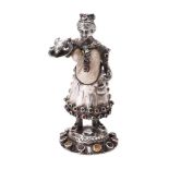 Y A German silver and mother of pearl standing figure