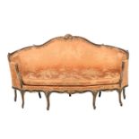 A Louis XV carved giltwood and painted sofa