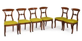 A set of six walnut dining chairs