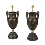 A pair of French bronze patinated spelter urns