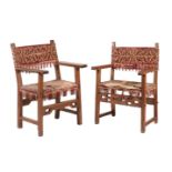 Two similar Iberian walnut open armchairs