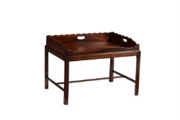 A grained mahogany tray on stand
