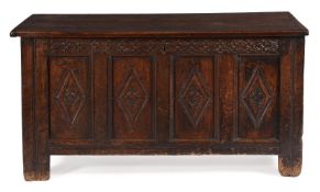 A Charles II panelled oak chest or coffer