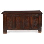 A Charles II panelled oak chest or coffer