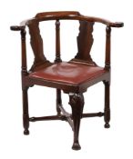 A George III mahogany corner armchair