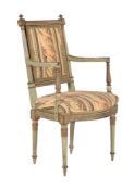 A green painted and parcel gilt open armchair in Louis XVI style