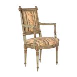 A green painted and parcel gilt open armchair in Louis XVI style