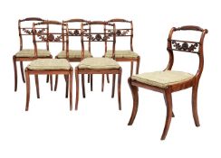A set of six Regency beechwood dining chairs