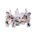 A group of nine various Staffordshire equestrian figures