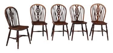 A harlequin set of ten wheel back side chairs