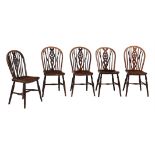 A harlequin set of ten wheel back side chairs