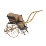 A Victorian painted iron, wood and wicker child's pram