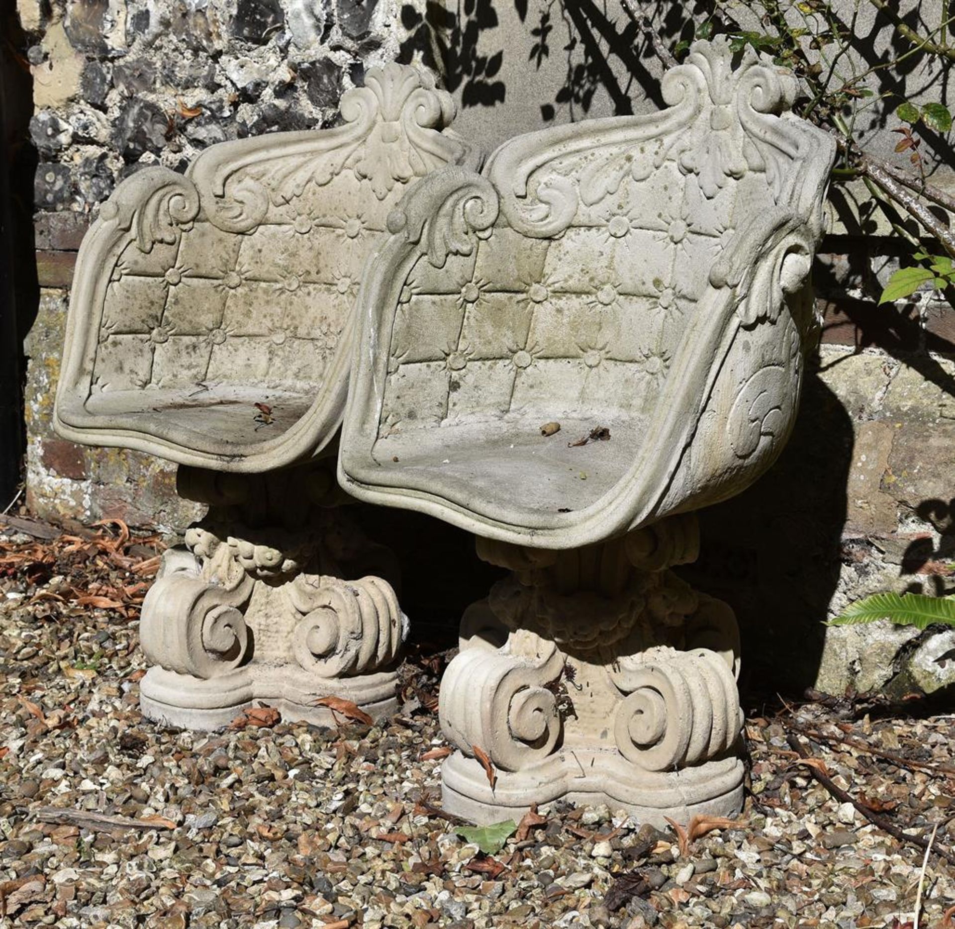 A pair of stone composite cast garden tub chairs