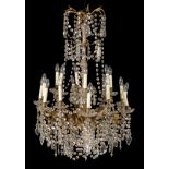A gilt metal and glass eighteen light chandelier
