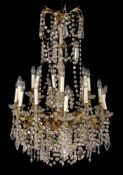 A gilt metal and glass eighteen light chandelier