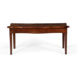 A George III mahogany serpentine serving table