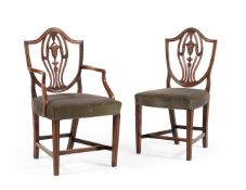 A set of twelve dining chairs in George III style