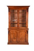 A Victorian mahogany bookcase cabinet
