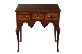 A George II oak side table or lowboy