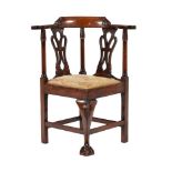 A mahogany child's corner armchair in George III style