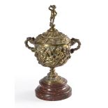A two handled gilt brass pedestal cup and cover