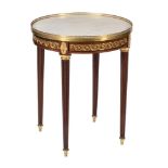 A French mahogany and gilt metal mounted gueridon table in Louis XVI style