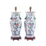 A pair of modern Chinese porcelain hexagonal section famille rose lamp bases