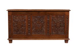 A carved oak coffer in late 17th century style